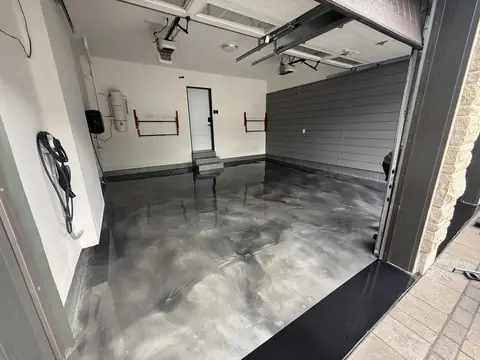Garage with a grey metallic epoxy floor